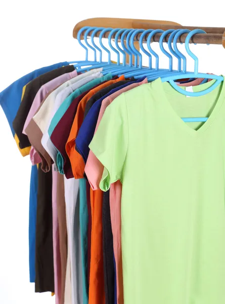 T-shirts hanging on hangers — Stock Photo, Image