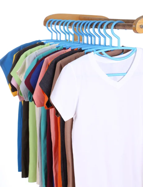 T-shirts hanging on hangers — Stock Photo, Image