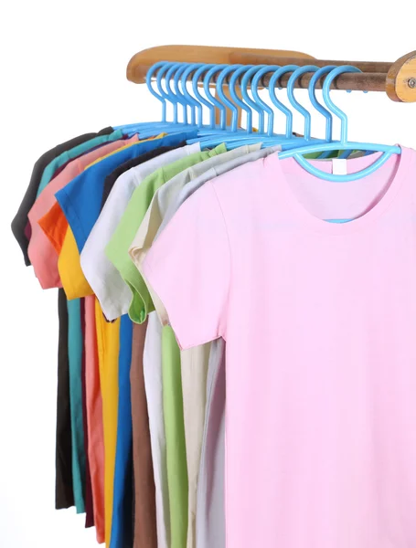 T-shirts hanging on hangers — Stock Photo, Image