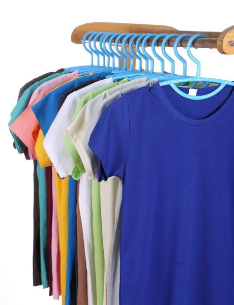 T-shirts hanging on hangers — Stock Photo, Image