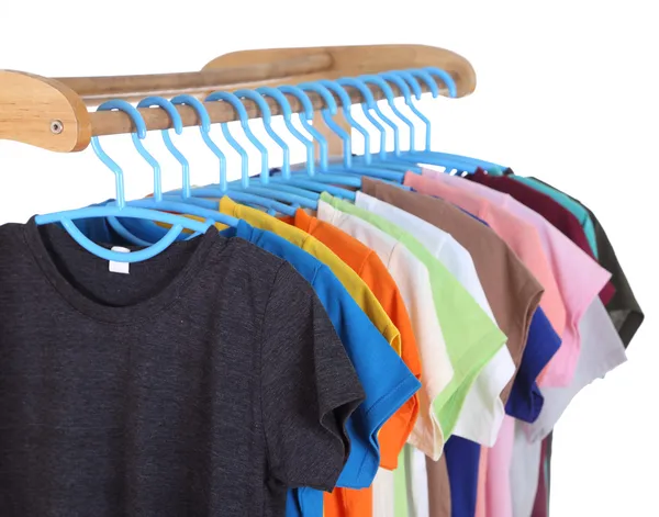 T-shirts hanging on hangers — Stock Photo, Image