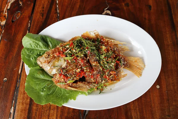 Fried ruby fish topped with sweet,sauer and hot sauce — Stock Photo, Image