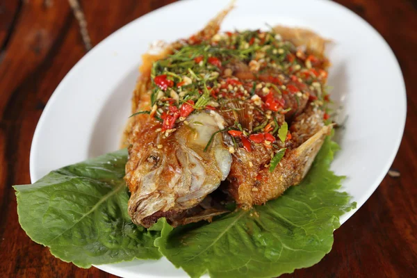 Fried ruby fish topped with sweet,sauer and hot sauce — Stock Photo, Image