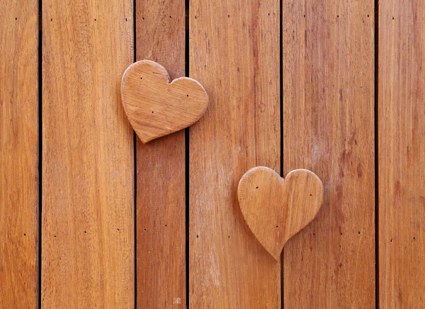 Trä hjärtan på trä bakgrund — Stockfoto