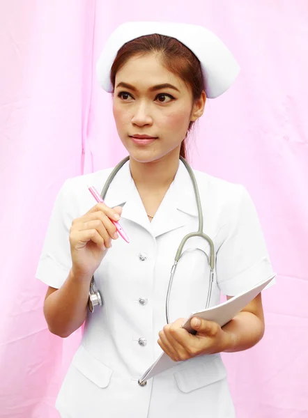 Female nurse with medical report — Stock Photo, Image