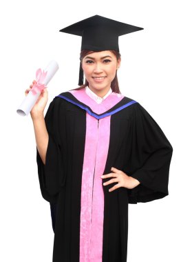 woman with graduation cap and gown with arm raised holding diplo