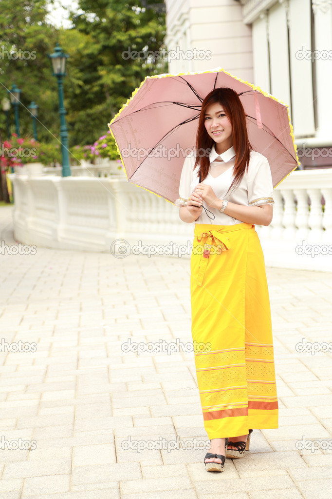 Thai girl dressing and umbrella with traditional style
