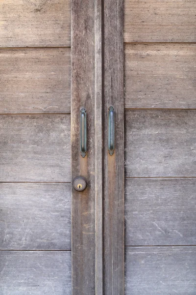 Handle on wooden door — Stock Photo, Image