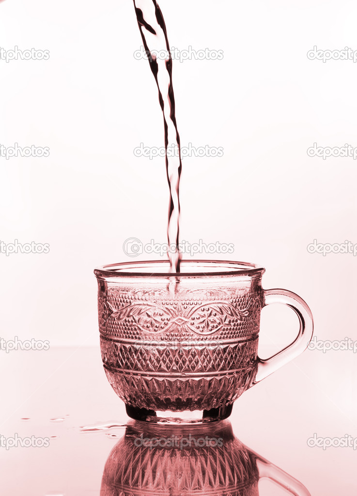 cup glass with water pouring