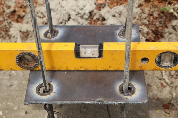 Construction level meter checking — Stock Photo, Image