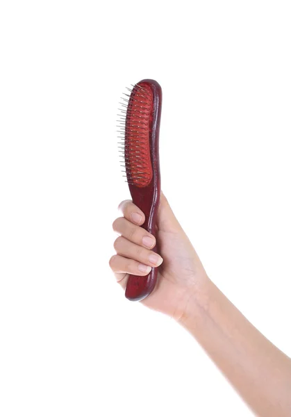 Main avec brosse à cheveux — Photo