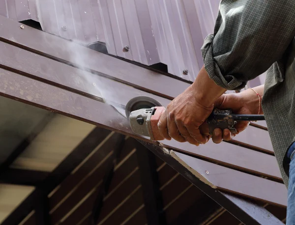 Worker use small grinding tool — Stock Photo, Image