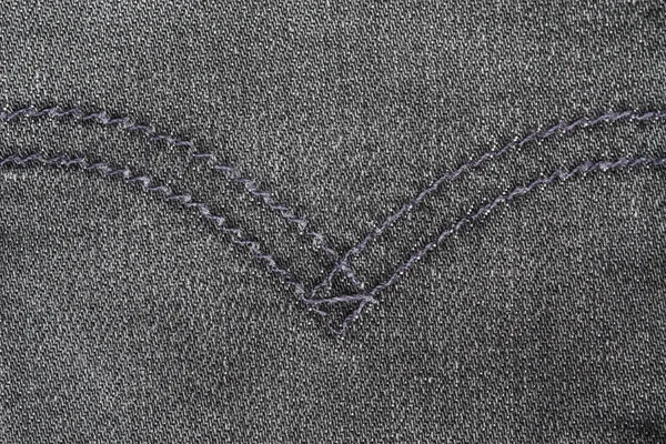 Blauwe jean textuur met steken — Stockfoto