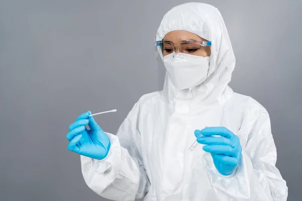 Female Doctor Protective Suit Ppe Holding Coronavirus Covid Nasal Swab — Stock Photo, Image