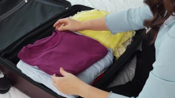 Woman Packing Suitcase Luggage Including Face Mask Alcohol Spray Protect — Stock Video