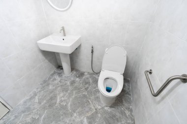 white bathroom with toilet and sink