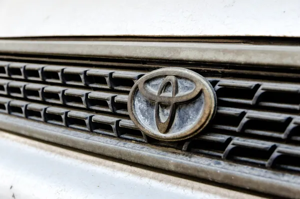 Logo of Toyota old Corolla on display.Toyota Group is best known — Stock Photo, Image