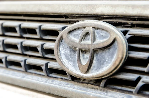 Logo of Toyota old Corolla on display.Toyota Group is best known — Stock Photo, Image