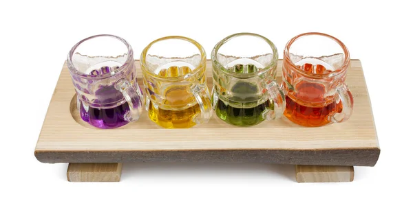Four Mini Pitchers on a Wooden Tray — Stock Photo, Image