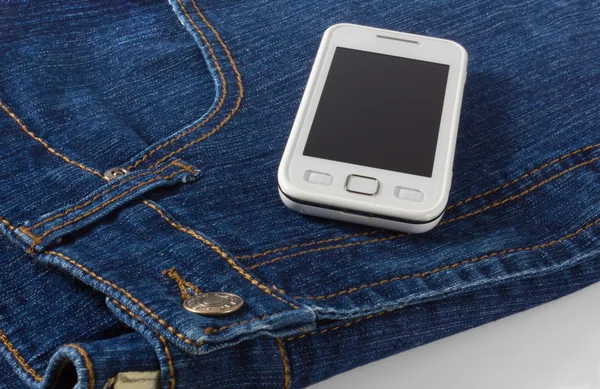 Mobile Phone on Blue Jeans — Stock Photo, Image