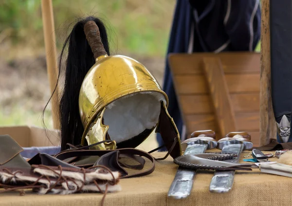 Ancient Roman helm and other war equipment — Stock Photo, Image