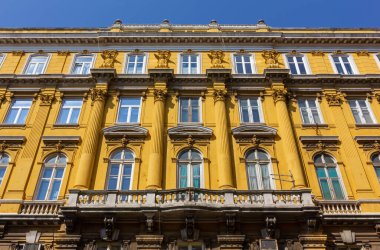 Richly decorated facade of historic Ploech palace in Rijeka, Croatia, designed by architect Giacomo Zammattio