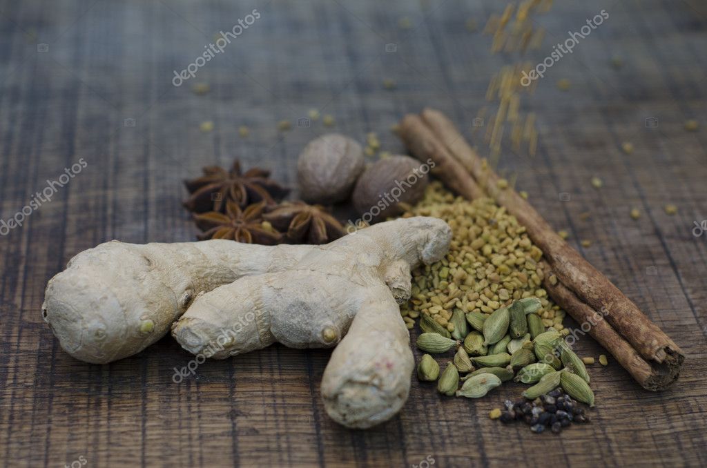 Fenugreek seeds, tumbling onto other ayurveda spices — Stock Photo
