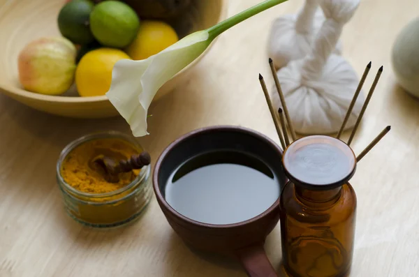 An arrangement of spice, oil and massaging tools used in Ayurved Royalty Free Stock Photos