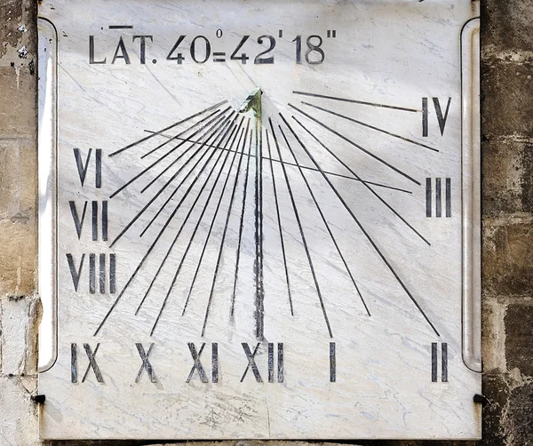 Ancient sundial on the wall a bell tower - Italy — Stock Photo, Image