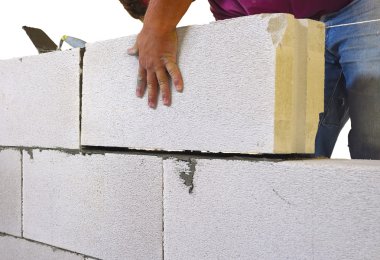 Mason performs an internal masonry blocks aerated concrete clipart