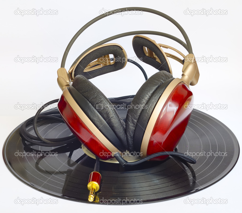 Wooden headphones arranged over some old 33 rpm records