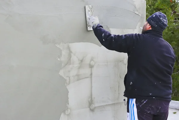 Builder worker plastering facade — Stock Photo, Image