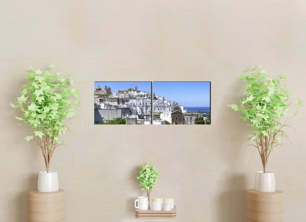 2-part wall canvas to decorate a living room wall with sofa. The canvas is panoramic view of Ostuni. Puglia. Italy.