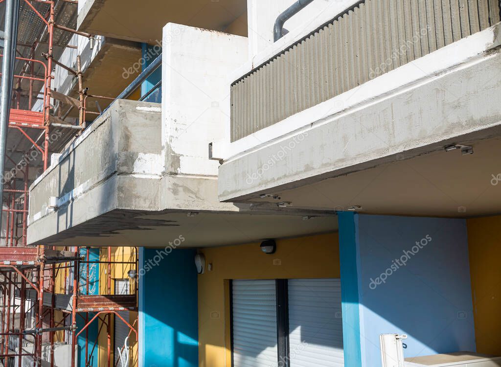 Balconies of condominium facade repaired after degradation and cracks in the reinforced concrete structure