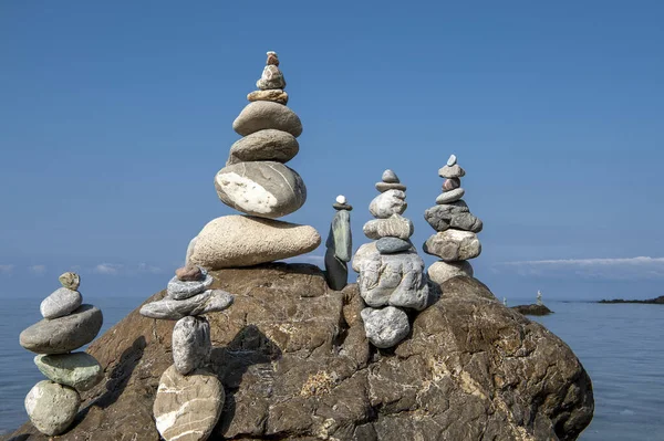 balanced stones on the rocks of the se