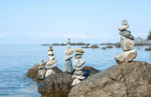 balanced stones on the rocks of the se