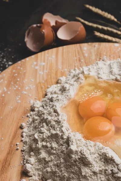 Flour and eggs as ingredients for making pasta dough