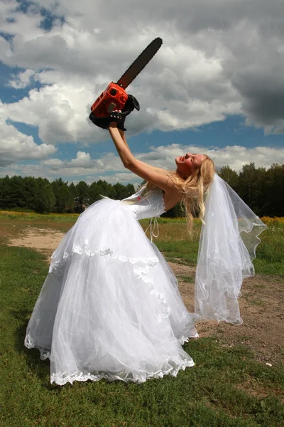 Crazy bride with red chainsaw — Stock Photo, Image