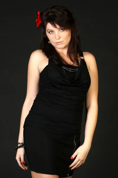 Pretty brunette woman in black dress — Stock Photo, Image