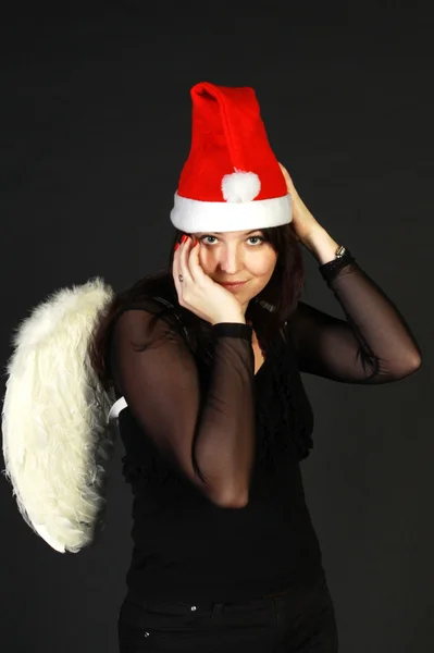 Woman in Santa hat with wings — Stock Photo, Image
