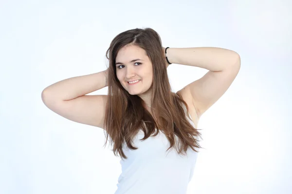 Pretty brunette woman in white top — Stock Photo, Image