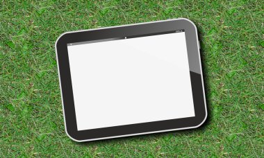 Tablet pc on green lawn or grass clipart