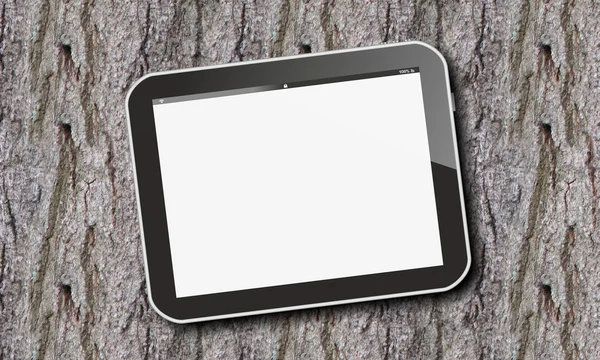 Tablet pc on tree bark — Stock Photo, Image