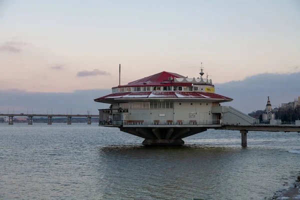 Dnipro, Ukraine -  December 23, 2021: Floating restaurant building on the water with the name Float in winter on the embankment in the city of Dnipro in Ukraine