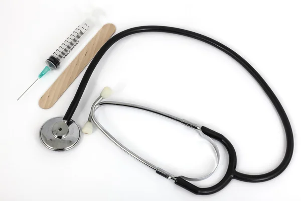 Stethoscope and medical syring — Stock Photo, Image