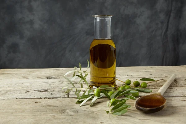 Olive branch and olive oil — Stock Photo, Image