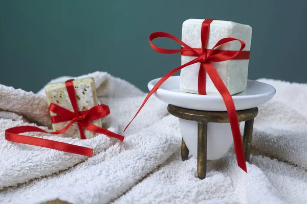 Handmade olive soap with olive branch and a towel, as a gift. — Stock Photo, Image