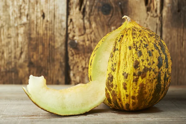 Fresh melon on a wooden table — Stock Photo, Image