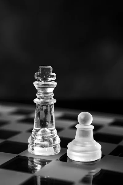 Glass chess board with chess pieces — Stock Photo, Image