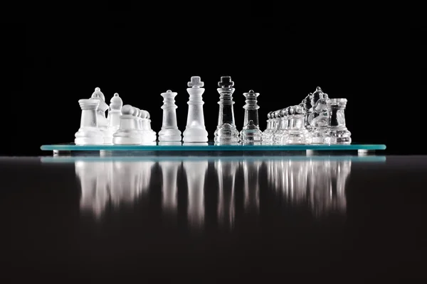 Glass chess board with chess pieces — Stock Photo, Image